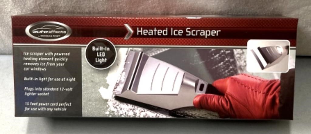Heated ice scraper
