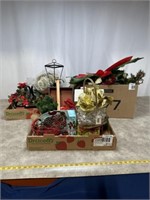 Holiday themed garland, candle holders, and other
