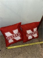 2 husker throw pillows