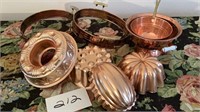 Copper color decor pieces, pans
