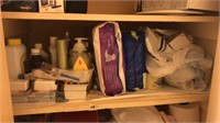 Shelf of assorted toiletries, first aid, etc