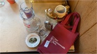 Flasks, pitcher, mugs, ashtray, wine tote bags