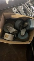 Box of swivel casters and box of nuts and bolts