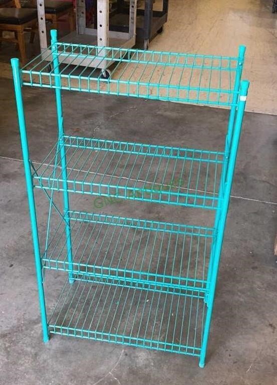 Four shelf metal storage rack measures 41 x 23 x