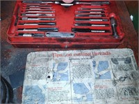 Drill bits and two tap and die sets.