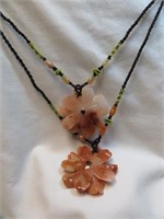 2 FLORAL GLASS PENDANTS ON CORDS