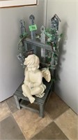 Angel statue with chair