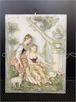 Porcelain wall hanging of two women  8 x 11"