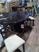 Oval kitchen table with two chairs and pedestal