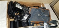 box of camera bodies and extra flashes
