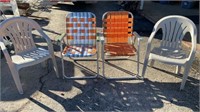 2 fold up lawn chairs and 2 patio chairs