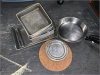 lot of pans and trivet