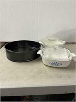 Two pieces of Corningware and a 10 inch cake pan