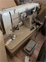 Vintage dressmaker, sewing machine with case.