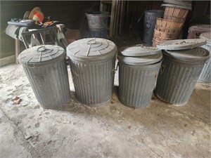 4 metal trash cans with extra lids