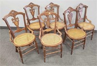 6 Victorian carved dining chairs with caned seats