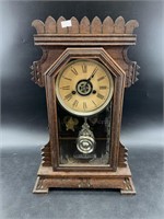 Antique Ansonia mantel clock, with key and pendulu