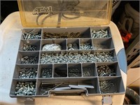 Storage container full of screws, knuts, etc