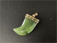 Small Kobuk jade claw shaped pendant about 1" long