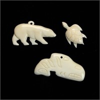 Three vintage ivory pendants