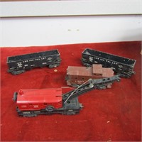 (4) Vintage Lionel cars/crane/caboose. 0 scale.