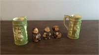 Ceramic monks drinking and green steins