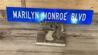 Marilyn Monroe book and road sign