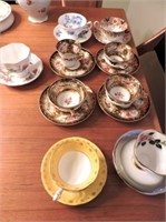 9 fancy cups & saucers