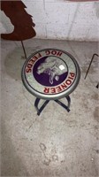 Metal stool reads pioneer hog feeds 16”