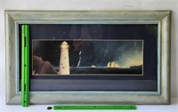 Framed boat and lighthouse picture