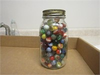 Antique marbles in jar.