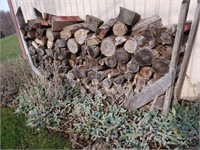 PILE OF WOOD OUTSIDE GARAGE