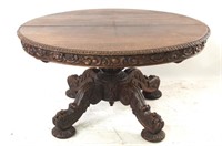 19th cent Carved oak oval pedestal table