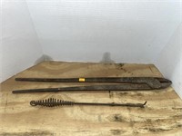 Antique blacksmith tongs and fire poker