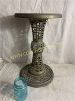 Intricate open cut metal plant stand