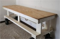 Wooden Table on larger casters, measuring stick no