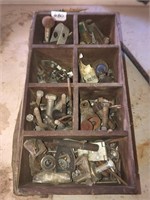 Wooden box with nuts and bolts and tire wrench