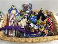 Wicker bin full of dog and cat toys