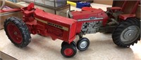 2 toy tractors MF & IH