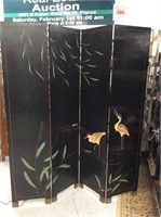 Black wall screen with cranes