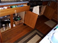 Contents of lower cabinet and single drawer to