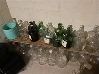 GLASS JUG COLLECTION IN BASEMENT