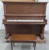 Upright piano with bench.