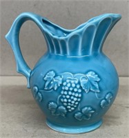 Pitcher with grape pattern