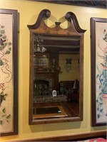 Beveled mirror with ornate top
