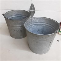 Pair of galvanized metal buckets with handles