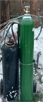 2 welding tanks on cart with hoses