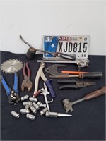 Group of tools and an Indiana license plate