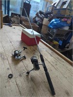 1 Fishing Rod, 2 Fishing Reels, and a Coleman