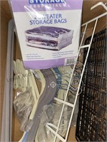 Box of hangers, sweater storage bags, and more